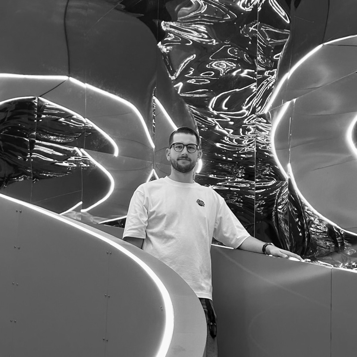 Max Holzinger inside a mirrored light installation
