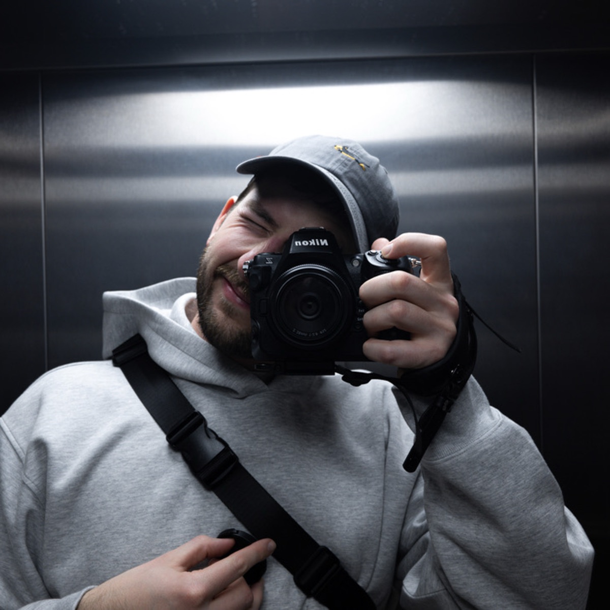 Self-portrait of Max with a camera