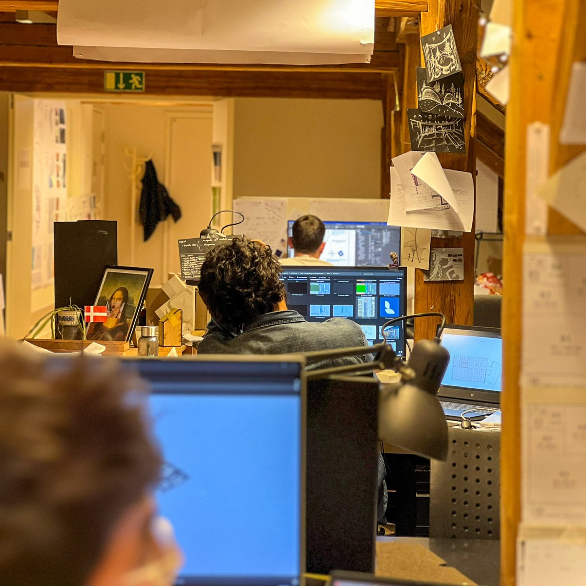 A studio workspace with screens and desks